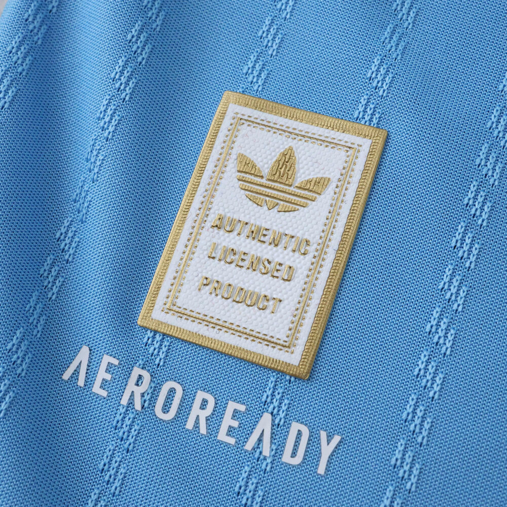 Close-up of Inter Miami CF 2025/26 Third jersey, showing Adidas badge and AEROREADY text on blue fabric.