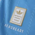 Close-up of Inter Miami CF 2025/26 Third jersey, showing Adidas badge and AEROREADY text on blue fabric.