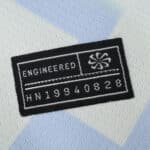 Close-up of the Inter Milan Away 2025/26 Fan Version jersey's engineered authenticity tag.