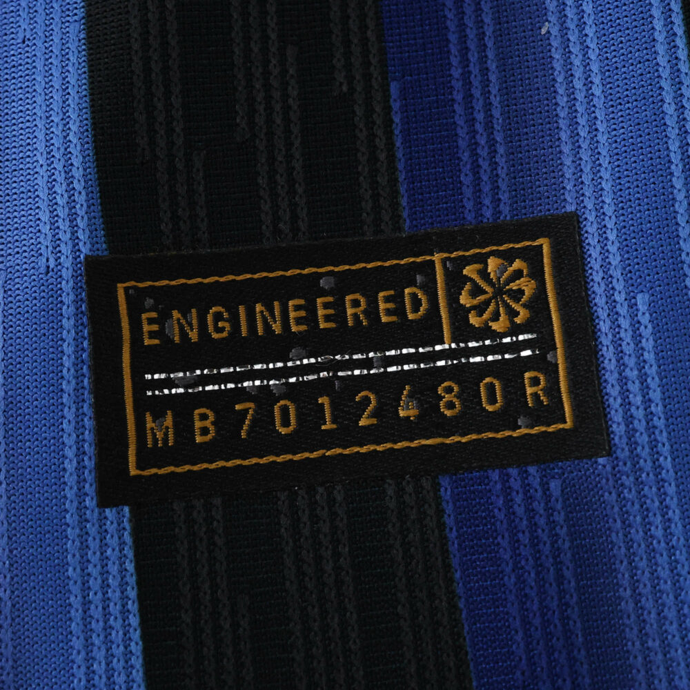 Close-up of the Inter Milan 2025/26 Home Player Version shirt fabric and engineered authenticity tag.