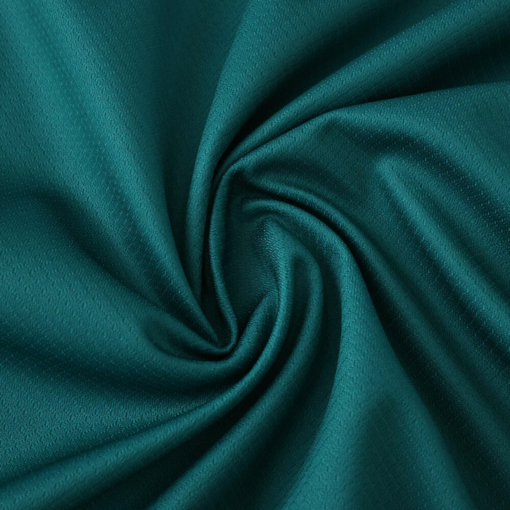 Close-up of teal Liverpool Third 2025/26 Fan Version jersey fabric, showing smooth texture and color.