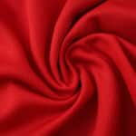 Red Manchester United Home 2025/26 Fan Version jersey fabric with textured spiral fold pattern.