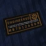 Close-up of the "Engineered" authenticity patch on the PSG 2025/26 Home Player Version jersey.