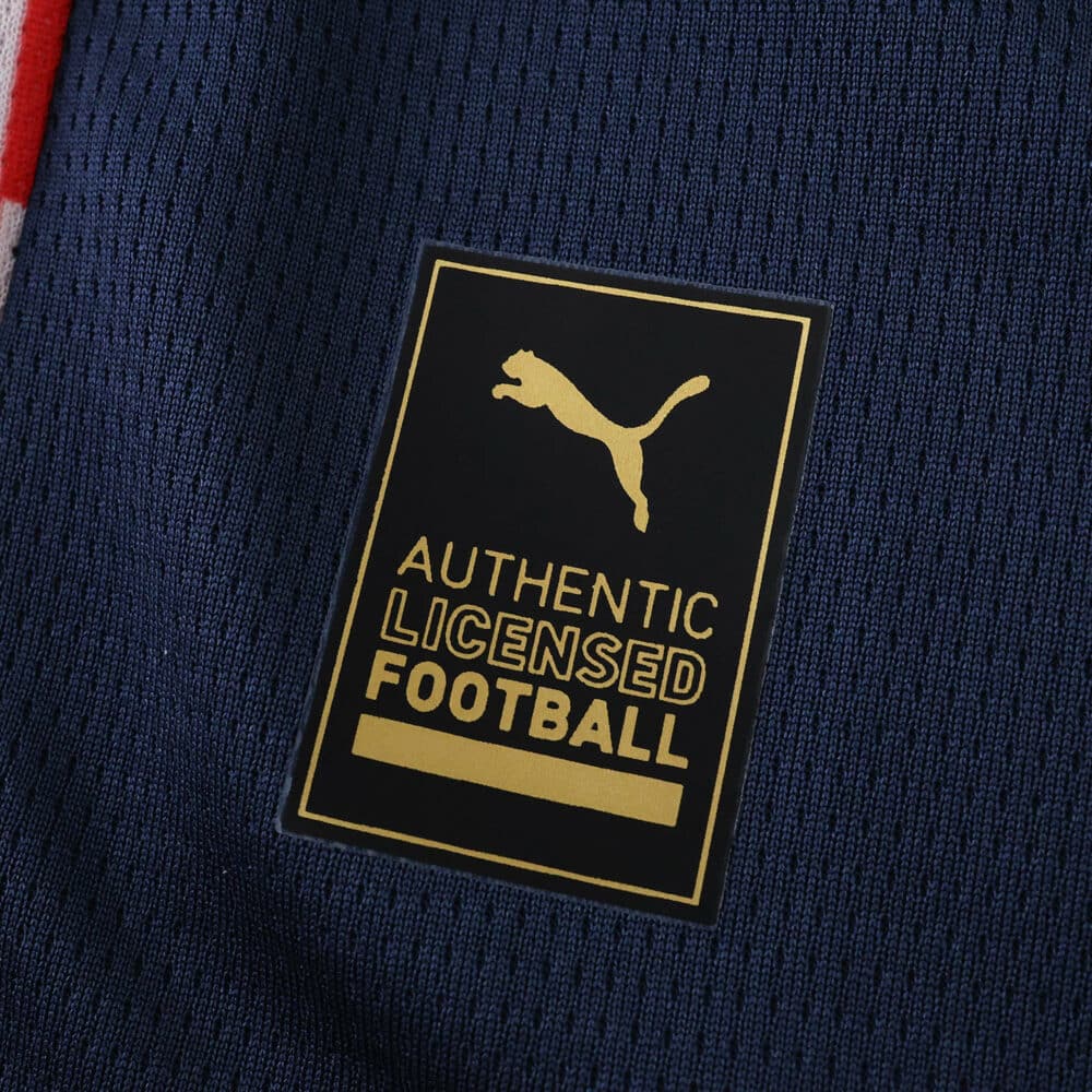 Close-up of the Puma Authentic Licensed Football badge on the PSV Eindhoven Away 2025/26 Fan Version jersey.