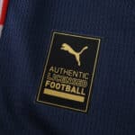 Close-up of the Puma Authentic Licensed Football badge on the PSV Eindhoven Away 2025/26 Fan Version jersey.
