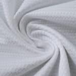 Close-up of white textured fabric used for the Rangers Away 2025/26 Fan Version jersey.