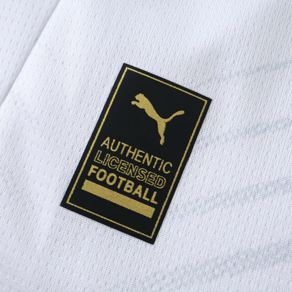 Close-up of the "Authentic Licensed Football" Puma badge on the RB Leipzig 2025/26 Home Fan Version shirt.