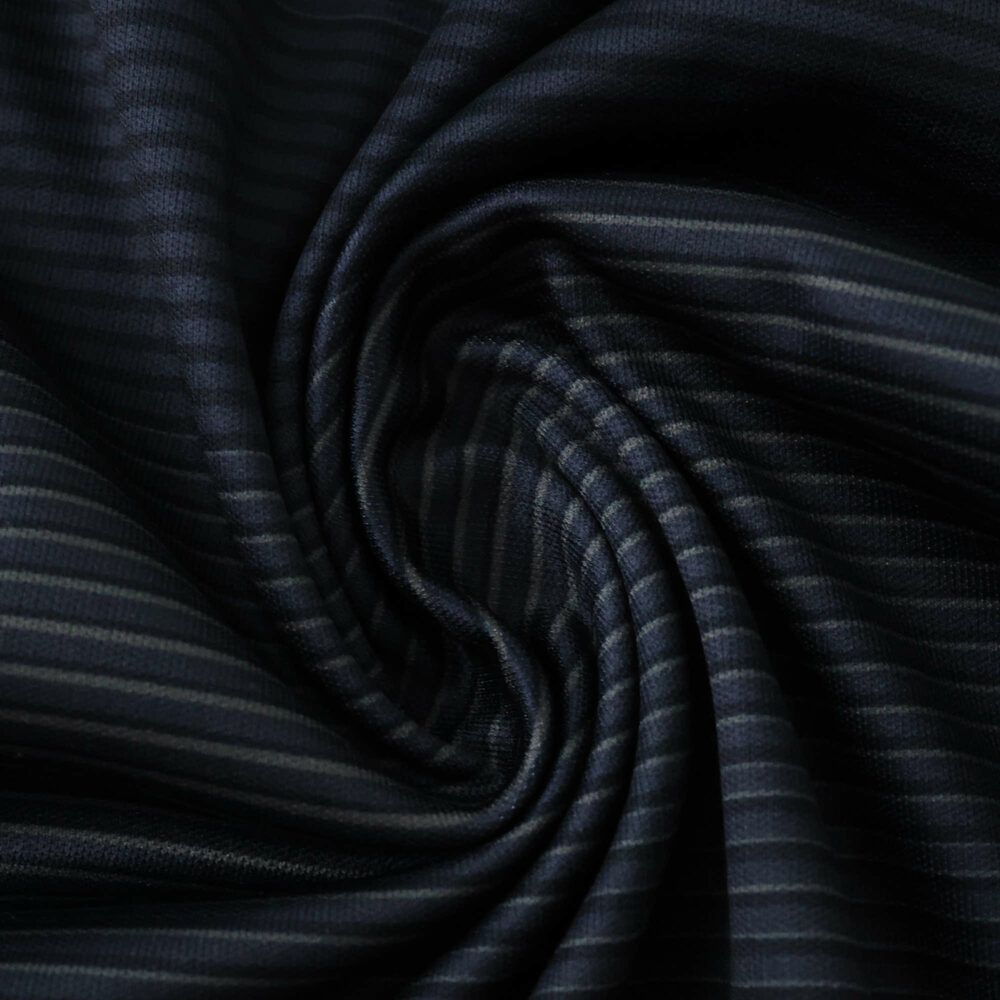 Close-up of navy blue striped fabric, Real Madrid Away 2025/26 Fan Version jersey material.