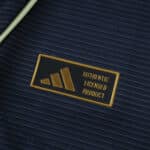 Close-up of the gold "Authentic Licensed Product" badge on the Real Madrid 2025/26 Away Player Version jersey.