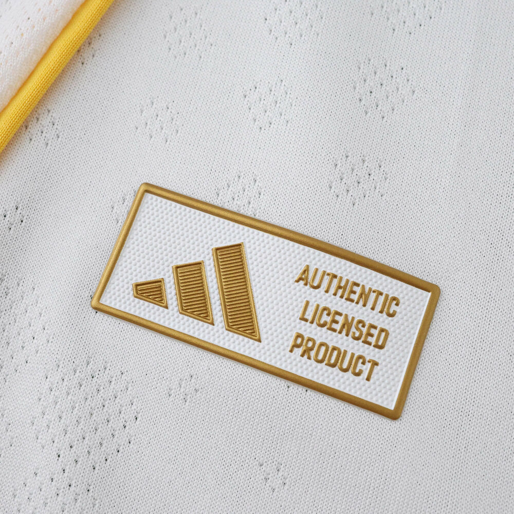 Close-up of the "Authentic Licensed Product" badge on the 2025/26 Real Madrid Home Player Version jersey.