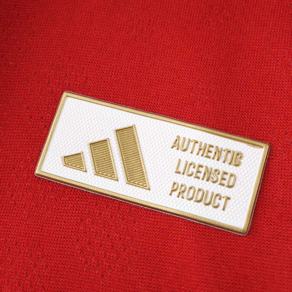 Close-up of the "Authentic Licensed Product" badge on the River Plate 2025/26 Home Player Version jersey.