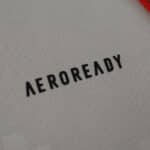 Close-up of the "AEROREADY" logo on the SL Benfica Away 2025/26 Fan Version jersey fabric.