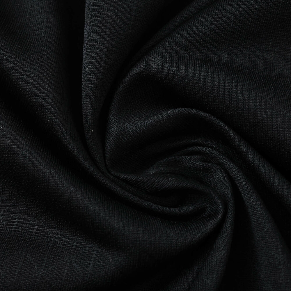 Close-up of black fabric used for the AC Milan Home 2025/26 Player Version jersey.