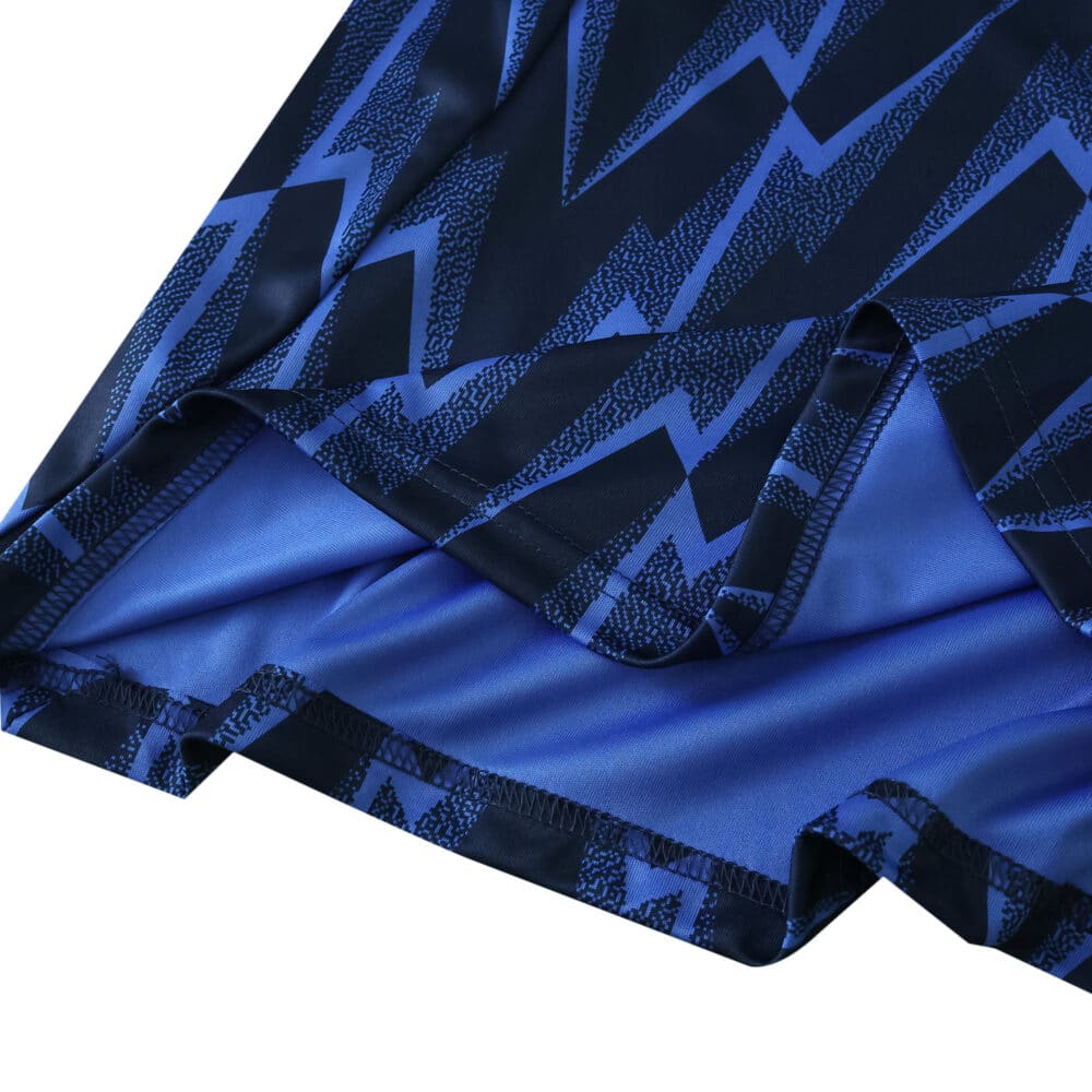 Close-up of the Arsenal Away 2025/26 Fan Version jersey fabric with blue zigzag pattern.
