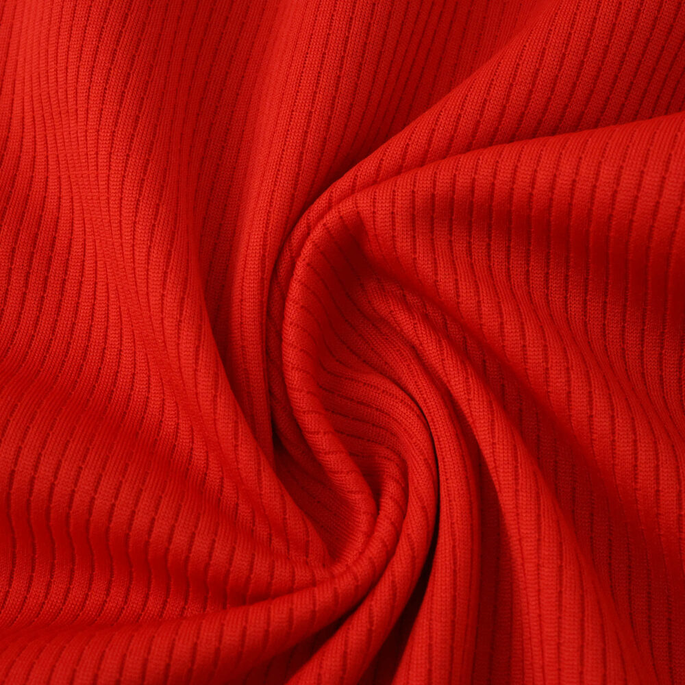 Close-up of the textured red fabric used for the Athletic Bilbao Home 2025/26 Fan Version jersey.