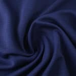 Close-up of navy blue fabric texture for Atlético Madrid Away 2025/26 Fan Version jersey.
