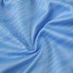 Close-up of the light blue fabric used for the Celta Vigo 2025/26 Home Fan Version jersey.