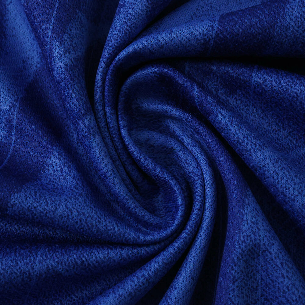 Close-up of Chelsea 2025/26 Home Fan Version jersey fabric in deep blue with subtle pattern details.