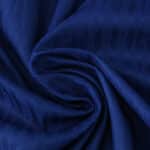 Close-up of FC Porto Home 2025/26 Player Version jersey fabric showing texture and rich blue color.