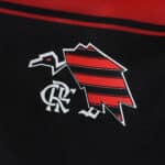 Close-up of Flamengo 2025/26 home fan jersey featuring the club's stylized vulture and CRF monogram.
