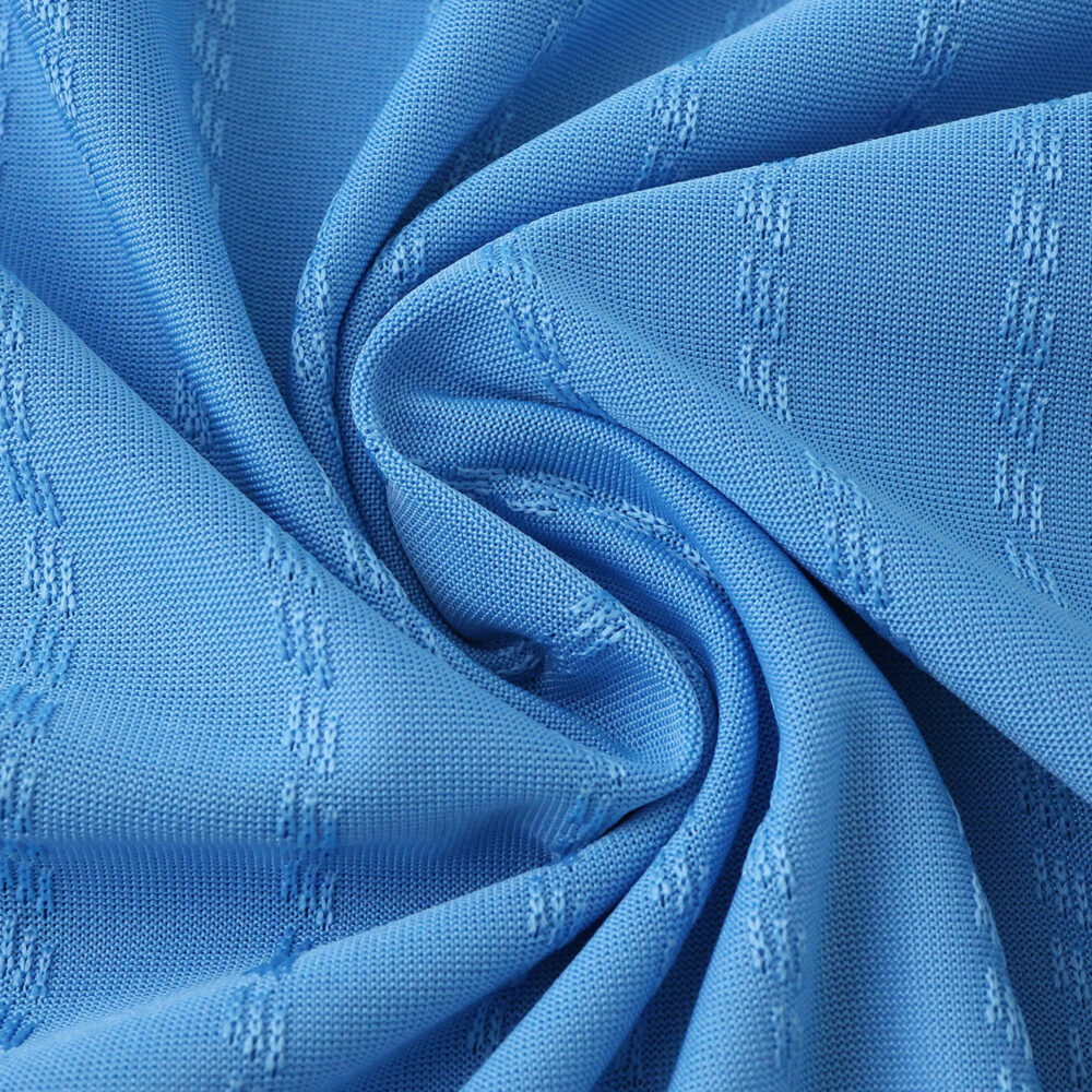 Close-up of Inter Miami CF Third 2025/26 Player Version jersey fabric in light blue with textured pattern.