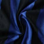 Close-up of Inter Milan 2025/26 Home Player Version jersey fabric showing blue and black stripes.