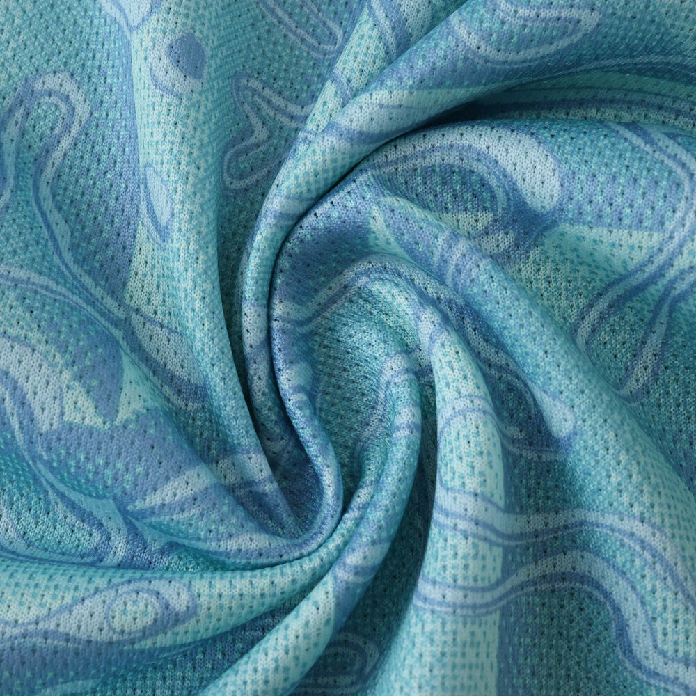 Close-up of Juventus Away 2025/26 Player Version jersey fabric in light blue with abstract patterns.