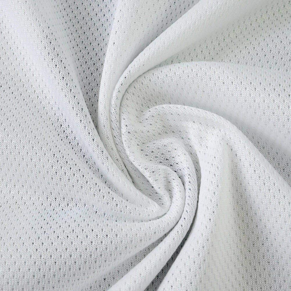 Close-up of Juventus Home 2025/26 Player Version jersey fabric showing white, breathable mesh texture.
