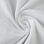 Close-up of Juventus Home 2025/26 Player Version jersey fabric showing white, breathable mesh texture.