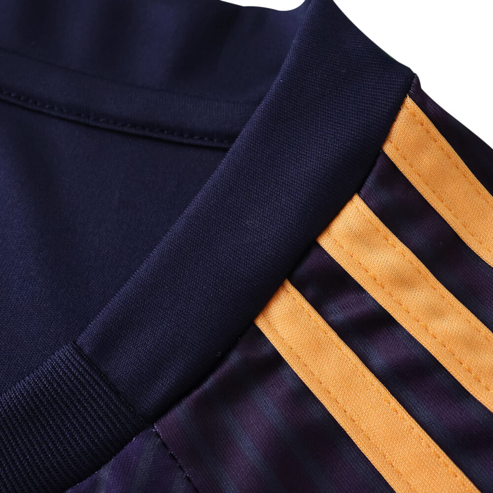 Close-up of LA Galaxy 2025/26 Away Fan Jersey, showing navy fabric and gold shoulder stripes.