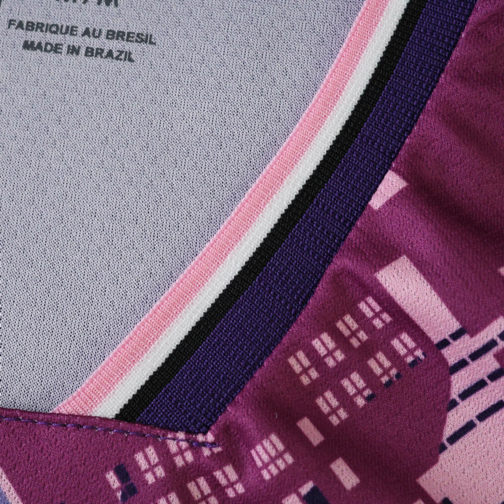 Close-up of Lille LOSC Away 2025/26 Fan Version jersey collar showing purple and pink city pattern.