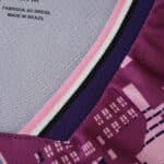 Close-up of Lille LOSC Away 2025/26 Fan Version jersey collar showing purple and pink city pattern.