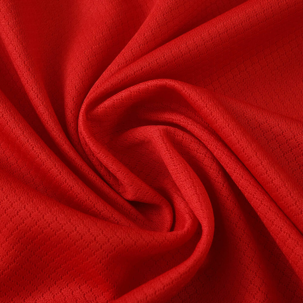 Close-up of red Lille LOSC 2025/26 Home fan jersey fabric, showing texture and material quality.