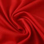 Close-up of red Lille LOSC 2025/26 Home fan jersey fabric, showing texture and material quality.