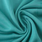 Close-up of teal fabric texture used in the Liverpool Third 2025/26 Player Version jersey.