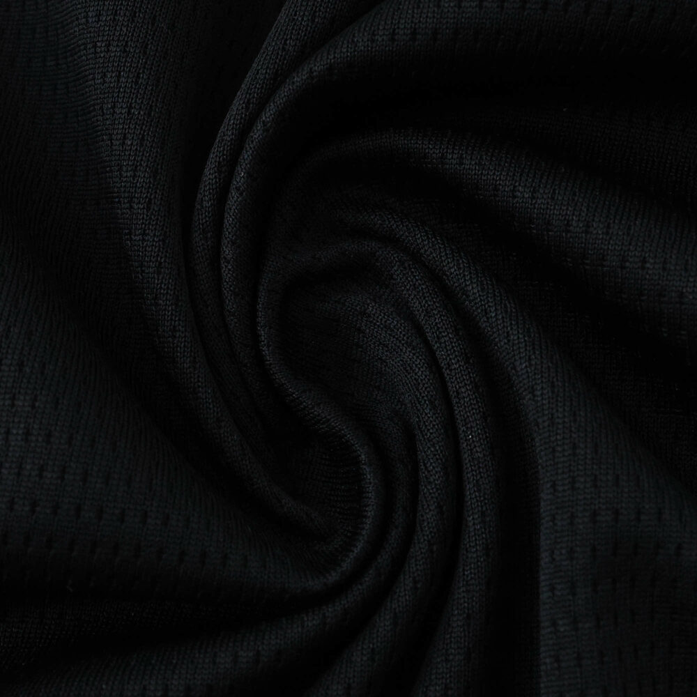 Close-up of the dark textured fabric used in the Manchester City Away 2025/26 Fan Version jersey.