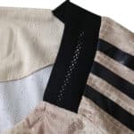 Detail of the New York Red Bulls 2025/26 Away Player Version jersey collar and shoulder stripes.