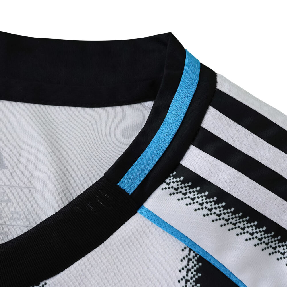 Close-up of Newcastle United 2025/26 Home Fan Version jersey collar with black, blue, and white details.