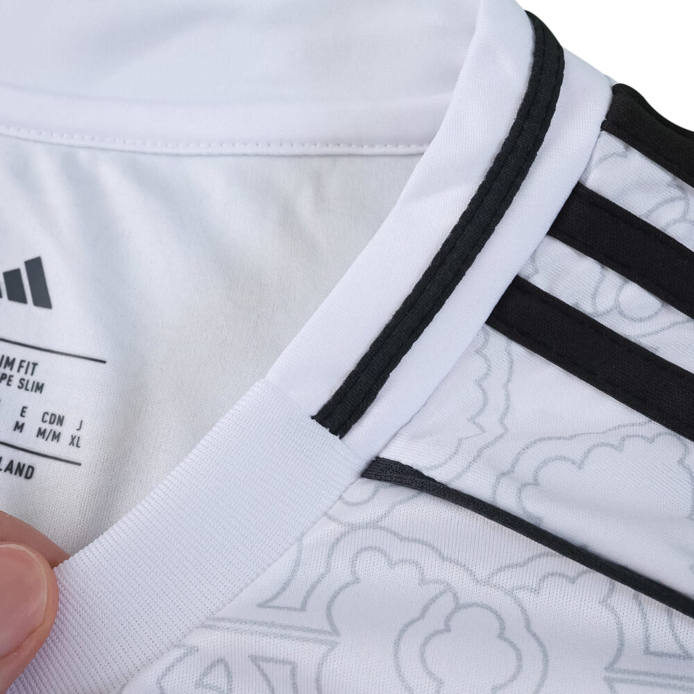 Close-up of the Nottingham Forest Away 2025/26 Fan Version jersey showing collar and pattern details.