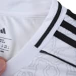 Close-up of the Nottingham Forest Away 2025/26 Fan Version jersey showing collar and pattern details.