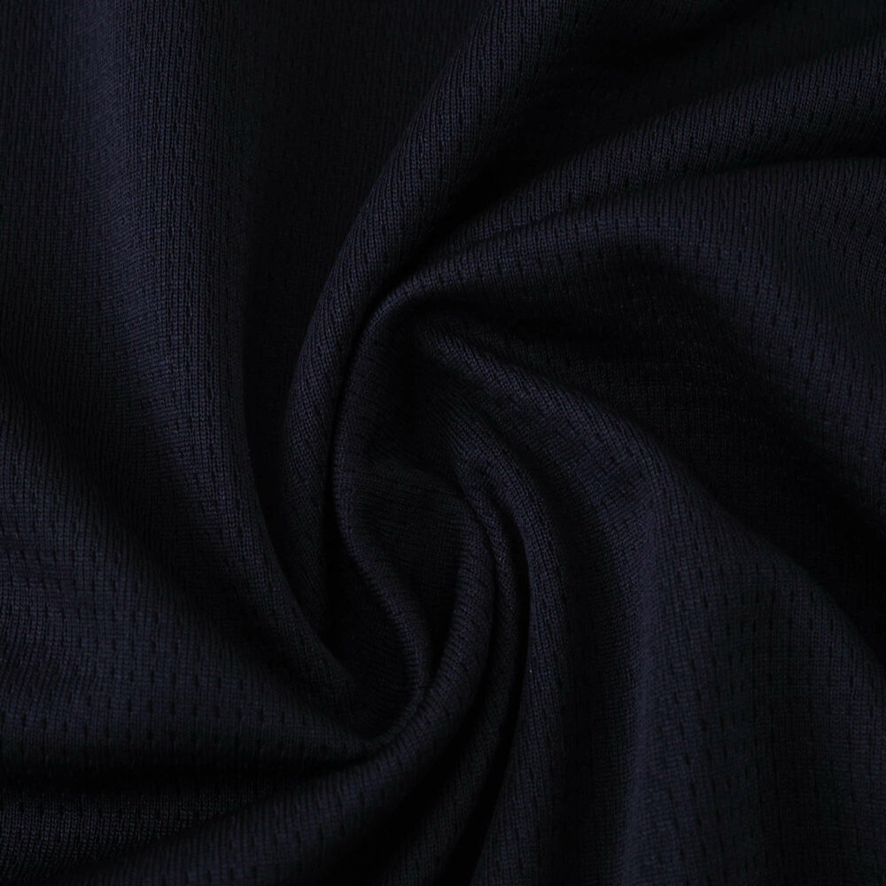 Close-up of Olympique Marseille 2025/26 Away Fan Version jersey fabric in dark navy color.