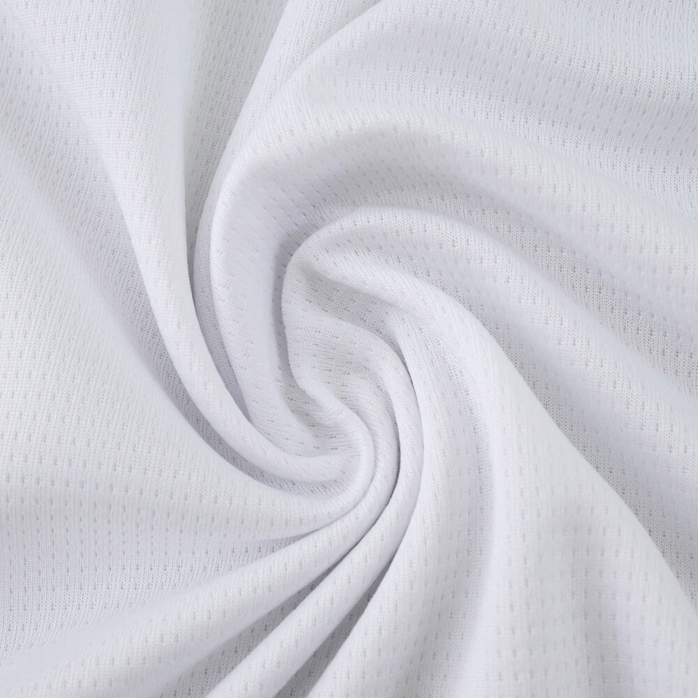 Close-up of white textured fabric used in the Olympique Marseille Home 2025/26 Fan Version jersey.