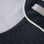 Close-up of the 2025/26 Real Madrid Away Fan Version jersey showing dark stripes and contrasting trim.
