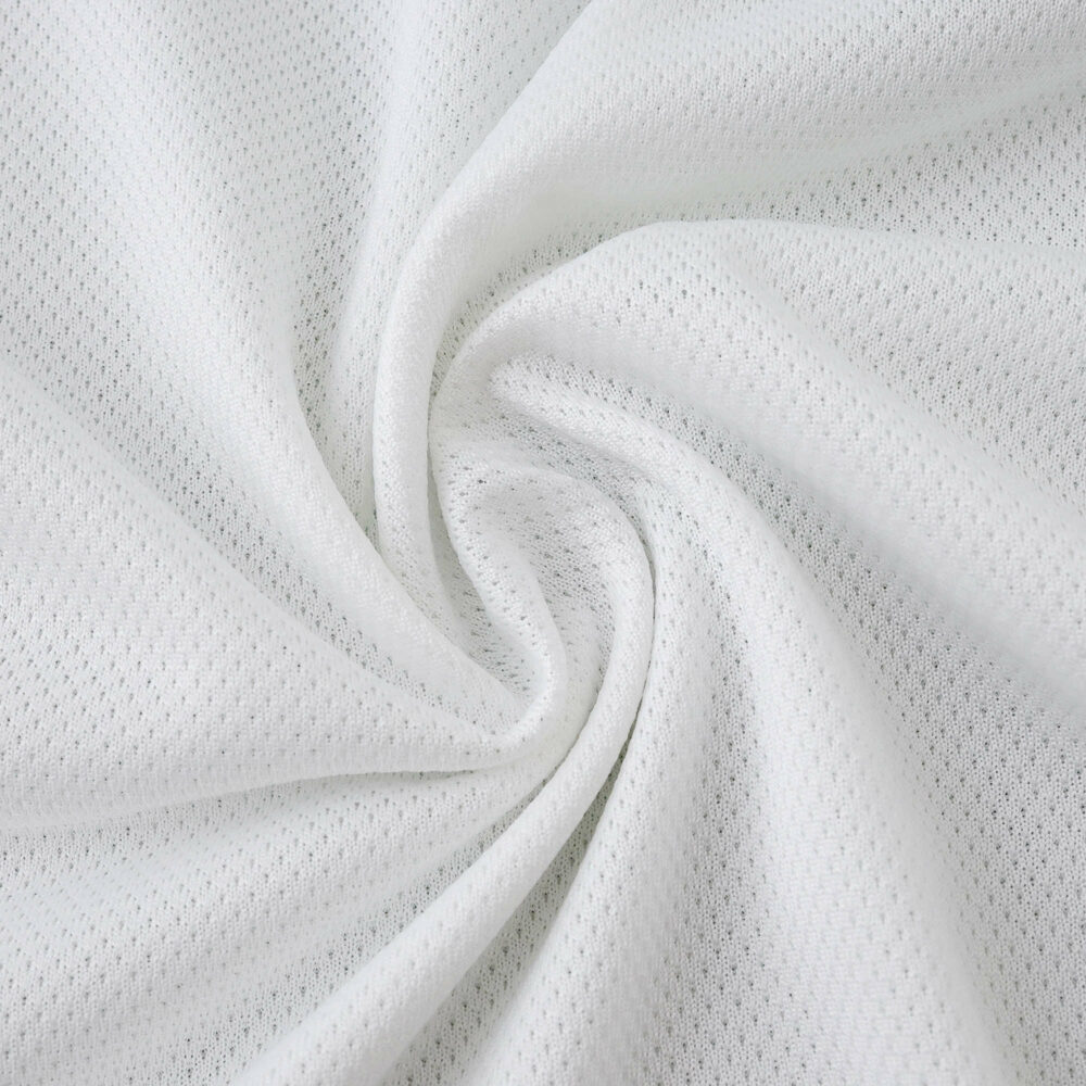 Close-up of white mesh fabric used in the Real Madrid Home 2025/26 Player Version jersey.