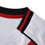 Close-up of the River Plate Home 2025/26 Fan Version jersey collar with red, white, and black details.