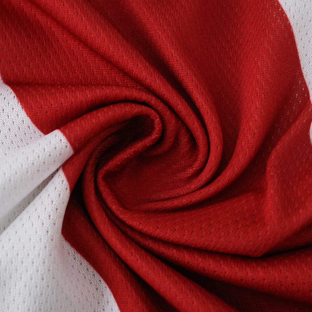 Close-up of River Plate Home 2025/26 Player Version jersey fabric in red and white.