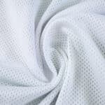 Close-up of white breathable mesh fabric used in the Sporting CP Home 2025/26 Fan Version jersey.