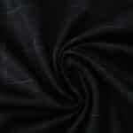 Close-up of Tottenham Hotspur Away 2025/26 fan jersey fabric, showing dark texture and subtle "SPURS" pattern.
