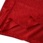 Close-up of Arsenal 2025/26 Home Player Version jersey showing red fabric with embossed AG pattern.