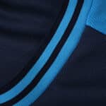 Close-up of Athletic Bilbao Away 2025/26 Fan Version jersey showing blue and navy collar detail.